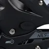 A close-up view of a black inline skate, showing details like the 'PUSH' button, 'ABEC 7' bearing rating, and the 'NILS' brand logo. Voir les images du produit