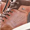 A close-up view of a brown leather bootie. Anteprima dell’immagine prodotto
