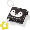 A black and white fabric book for babies with a penguin design and a yellow teething ring. Produktbild-Vorschau