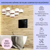 A modern bathroom with a bathtub and a wall-mounted heater. Podgląd zdjęcia produktu