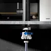Close-up view of the underside of a kitchen faucet installation, showing the mounting hardware and a water hose. Produktbild-Vorschau