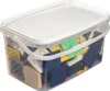 A clear, well-lit studio shot of a clear plastic tub filled with various colored leveling shims. Produktbild-Vorschau