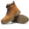 A pair of tan work boots with a white background. Produktbild-Vorschau