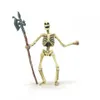 A toy skeleton figure holding a halberd, isolated on a white background. Náhľad obrázku produktu