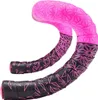 A pair of bicycle handlebars wrapped in pink and black tape with a geometric pattern. Produktbild-Vorschau
