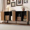 A modern sideboard with open doors, displaying storage items and decorative elements, set in a living room environment with artwork on the wall. Anteprima dell’immagine prodotto