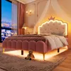 A pink princess-themed bed with LED lighting in a bedroom setting. Podgląd zdjęcia produktu
