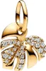 A close-up studio shot of a gold monstera leaf charm with small clear stones. Podgląd zdjęcia produktu