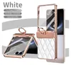 A product image showcasing a white phone case with rose gold accents and a diamond-like embellishment. The case is shown in both open and closed positions, with a ring holder attached. Produktbild-Vorschau