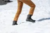A person walking in the snow. Produktbild-Vorschau