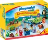 The image shows the front of a Playmobil 1.2.3 Advent Calendar box, depicting a winter forest scene with various Playmobil figures and animals. Produktbild-Vorschau