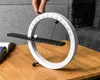 A hand is shown adjusting a magnetic calendar on a wooden table. Produktbild-Vorschau