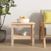 A wooden side table with a bowl of fruit and books on a shelf, next to a chair with a yellow cushion. Produktbild-Vorschau