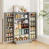 A gray pantry cabinet filled with various food items and kitchenware, placed against a white wall next to a window. Podgląd zdjęcia produktu