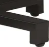 A close-up view of the black metal legs of a table, showing the feet with rubber stoppers. Náhled obrázku produktu