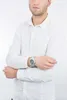 A man wearing a white shirt and a silver watch. Náhled obrázku produktu