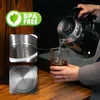 A person is pouring hot water from a black electric kettle into a glass. Close-ups of the kettle's interior and base are shown. Podgląd zdjęcia produktu