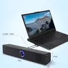 A black computer soundbar is shown connected to a laptop, with dimensions indicated by text overlays. Voir les images du produit