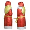 Two chocolate Santa figures wrapped in red and gold foil, presented side-by-side against a white background. Náhled obrázku produktu