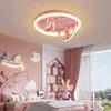 A child's bedroom decorated in pink, featuring a bed, shelves, and a ceiling light. Produktbild-Vorschau