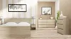 A bedroom scene with a bed, nightstand, and dressers. Podgląd zdjęcia produktu