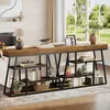 A long console table with shelves is placed in a living room setting, next to a sofa and a fireplace, with a window in the background. Náhled obrázku produktu