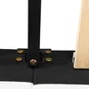 Close-up of the connection points of a bed frame, showing metal brackets and screws attaching a black fabric base to a black metal leg, with a wooden support on the right. Produktbild-Vorschau