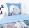 A close-up view of a bed with a pillow and duvet cover featuring a white horse. Produktbild-Vorschau