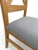 A close-up view of a wooden chair with a gray upholstered seat. Produktbild-Vorschau