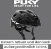 A black Puky bicycle helmet is shown against a gray background, with marketing text at the top and bottom. Náhľad obrázku produktu