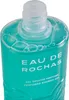 Close-up of the top of a teal-colored shower gel bottle. Voir les images du produit