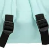 Close-up of the back straps and buckles of a light cyan backpack. Náhled obrázku produktu