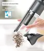 A hand is holding a handheld vacuum cleaner and emptying dust into a pile. Anteprima dell’immagine prodotto