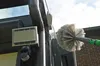 A cleaning brush is being used to clean a gutter and a light fixture on the side of a building. Produktbild-Vorschau