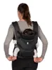 A woman is wearing a baby carrier with a baby inside, shown from the back. Náhľad obrázku produktu