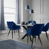 A dining room scene with a round table and chairs. Náhľad obrázku produktu