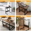 Collage of four images showing a mobile C-shaped table in different room settings: kitchen, bedroom, living room, and office. Anteprima dell’immagine prodotto