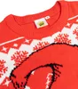 A close-up view of a red Christmas sweater with a Grinch design and snowflake patterns. Náhľad obrázku produktu