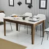 A dining table set up for a meal in a dining room. Produktbild-Vorschau