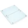 Two clear glass cutting boards with gray feet, displayed on a white background. Anteprima dell’immagine prodotto