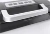 A close-up shot of the top portion of a black and silver vacuum sealer machine. Podgląd zdjęcia produktu