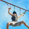 A young person is using a ninja line set outdoors. Produktbild-Vorschau
