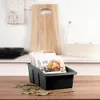 A black kitchen organizer filled with spice packets sits on a wooden countertop, with bay leaves scattered around it. Náhľad obrázku produktu