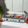 A KLAMER electric grill with food cooking on it, placed on a kitchen counter. Produktbild-Vorschau