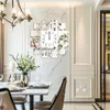 A dining room setting with a decorative clock on the wall. Anteprima dell’immagine prodotto