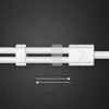 A close-up view of a white audio cable with two white connectors and a transparent clip, against a black textured background. Two white arrows pointing in opposite directions are shown below the cable. Anteprima dell’immagine prodotto