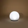 A white spherical lamp is shown on a brown background. Produktbild-Vorschau