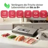 A vacuum sealer machine on a kitchen counter with various food items vacuum-sealed in plastic bags. Anteprima dell’immagine prodotto
