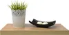 A shelf with a potted plant and a decorative bowl with candles. Náhled obrázku produktu