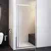 A modern bathroom with a shower enclosure, toilet, and toilet brush holder. Produktbild-Vorschau